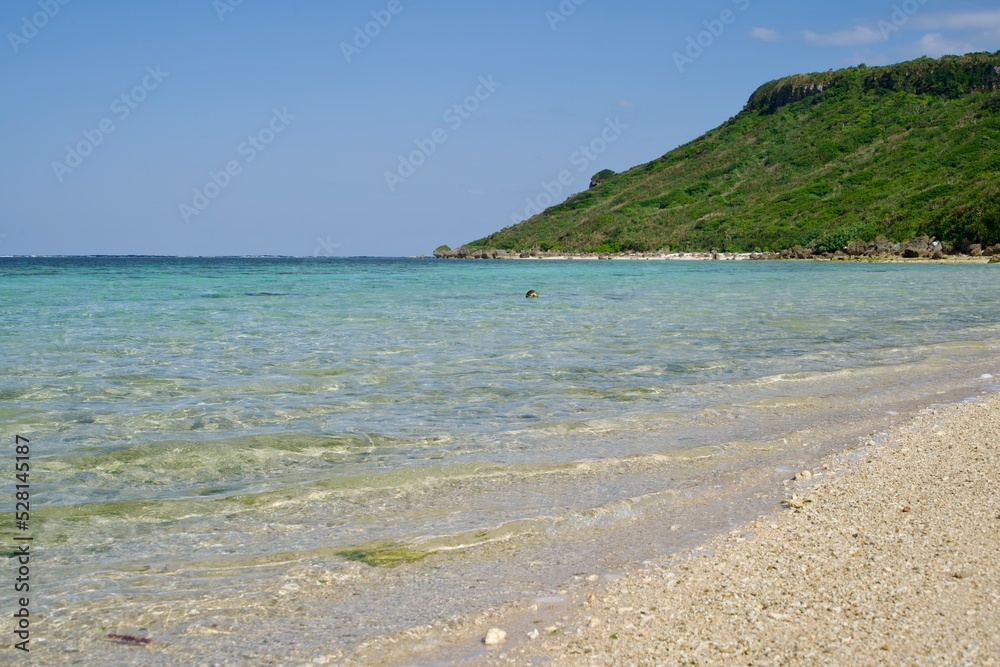 Scenery of the calm sea and peninsula of the Aragusuku Beach