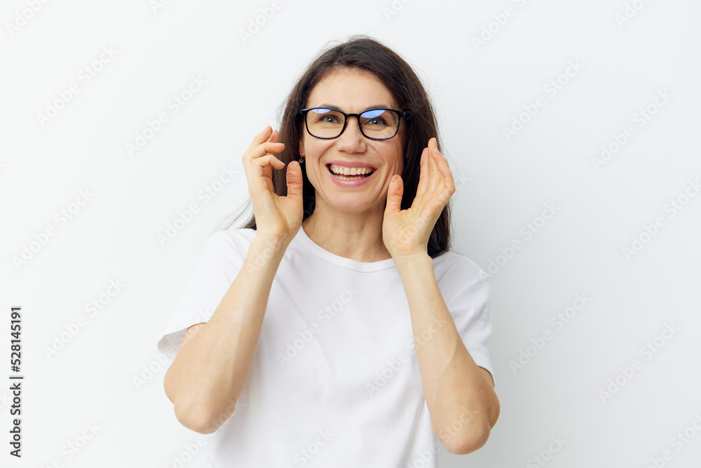 portrait of a nice, pleasant woman with a beautiful smile, in a white T-shirt and black glasses for vision. portrait of a nice, pleasant woman with a beautiful smile, in a white T-shirt and black glasses for vision.