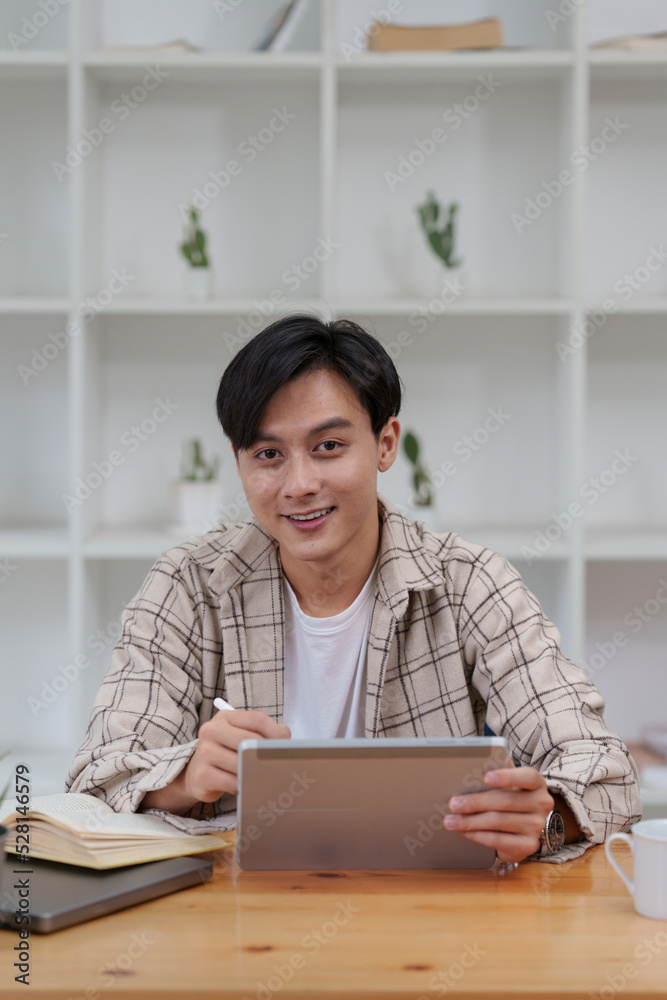 Graphic designer drawing in digital tablet at home. Creative concept Graphic designer drawing in digital tablet at home. Creative concept