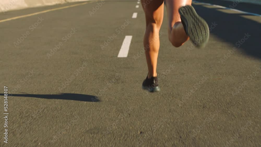 Fitness, freedom and health, a woman running a city road. Sports, exercise and motivation, a strong runner training for a marathon or race. Cardio, strength and sweat, healthy girl on street workout.