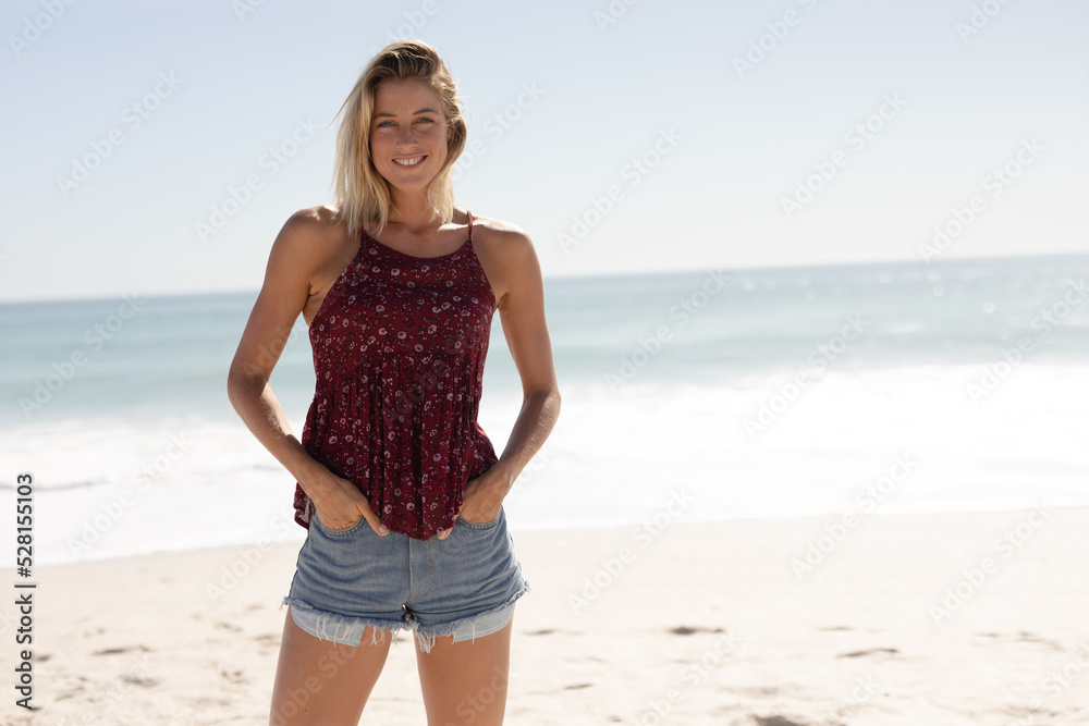 Young Caucasian woman smiling on the beach Young Caucasian woman smiling on the beach