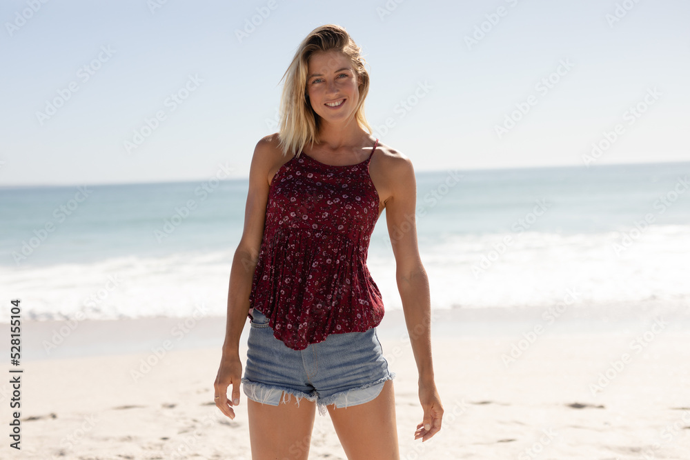 Young Caucasian woman smiling on the beach Young Caucasian woman smiling on the beach