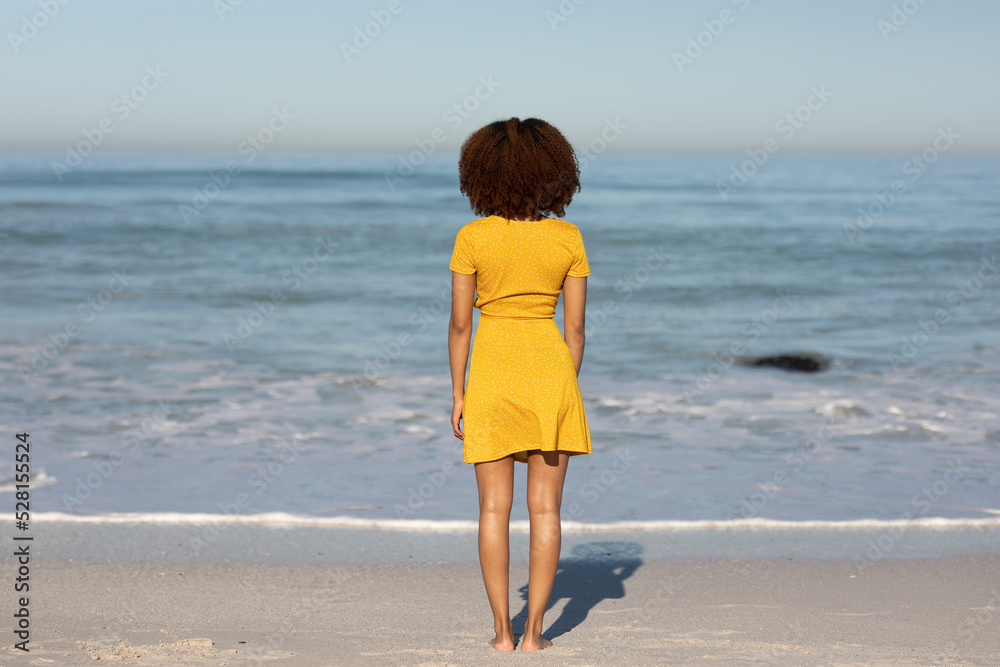 Mixed race woman enjoying her time on the beach