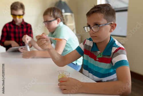 Group of elementary school kids in chemistry class