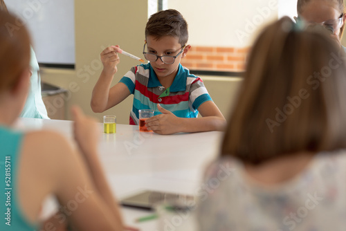 Group of elementary school kids in chemistry class