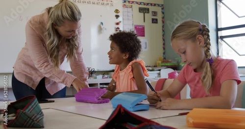 Female teacher teaching kids in the class