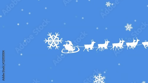 Animation of winter scenery with snowflakes falling and santa claus in sleigh being pulled by reinde photo