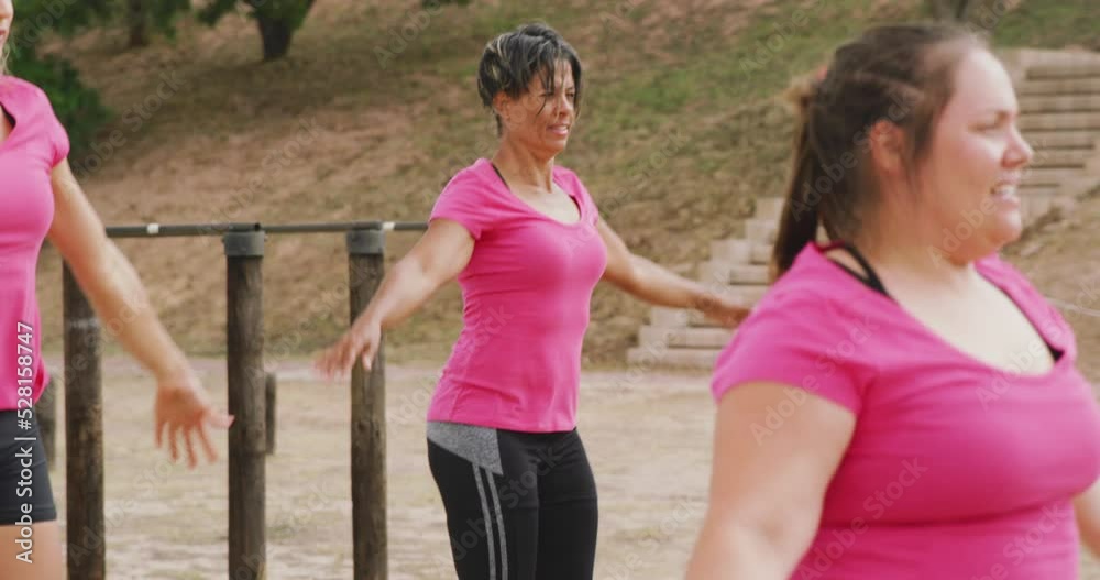 Female friends enjoying exercising at boot camp together Female friends enjoying exercising at boot camp together