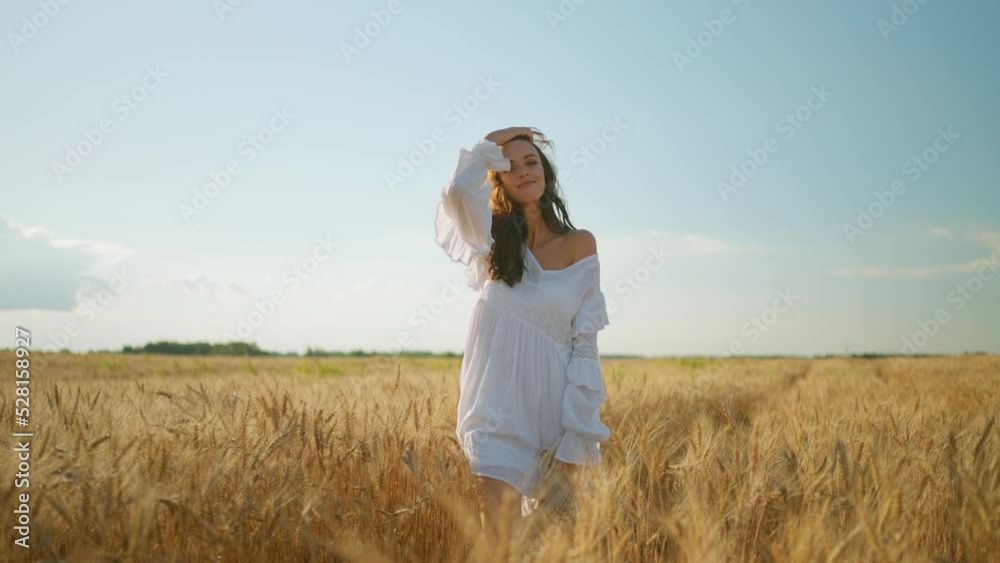 portrait of pretty brunette woman in white dress in golden rye field, beautiful lady with loose hair portrait of pretty brunette woman in white dress in golden rye field, beautiful lady with loose hair