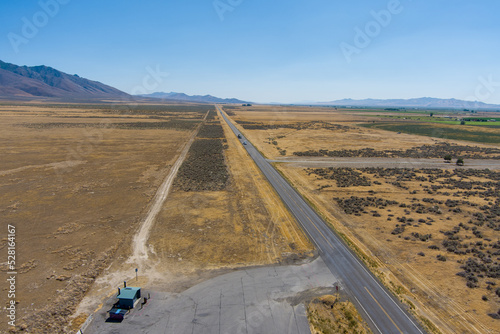 Aerial view of Highway 95 located in the Northern Nevada desert with a hazy blue sky and copy space. photo