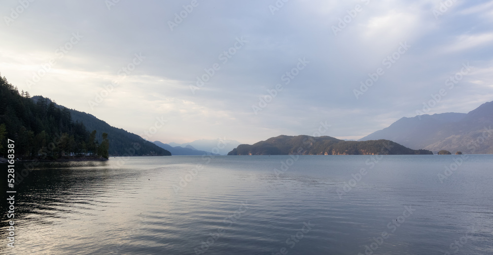 Harrison Lake with Canadian Mountain Landscape. Sunny Summer Sunset Sky. Harrison Hot Springs, British Columbia, Canada. Nature Background. Harrison Lake with Canadian Mountain Landscape. Sunny Summer Sunset Sky. Harrison Hot Springs, British Columbia, Canada. Nature Background.