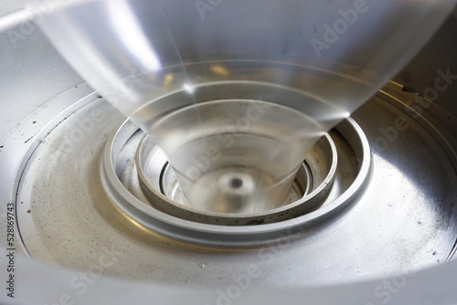 LDPE. extrusion blown film machine showing bubble extruded from die head through bubble stabilizer and steel roller.