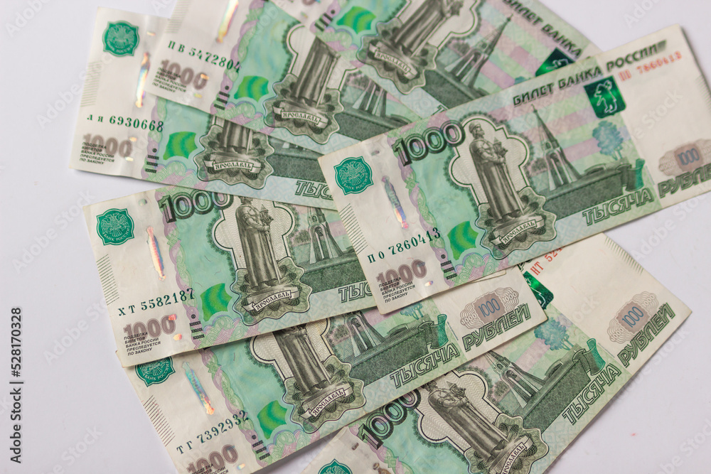 Russian money, banknote face value of one thousand rubles. Fall and devaluation of the russian ruble, crisis. Russian money, banknote face value of one thousand rubles. Fall and devaluation of the russian ruble, crisis.