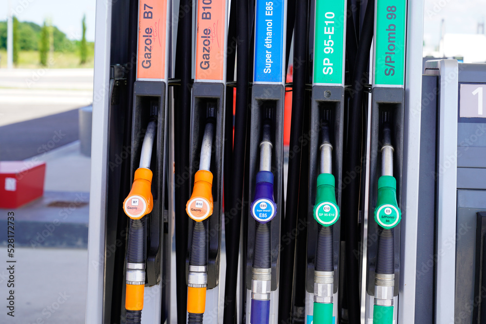 gas pump french text sign green yellow orange blue color fuel gasoline dispenser background gas pump french text sign green yellow orange blue color fuel gasoline dispenser background