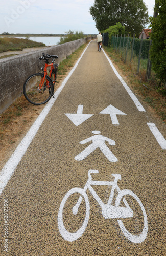 bicycle on the bike path in the plain and the symbol drawn on the asphalt