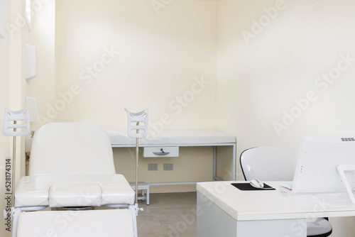 Gynecological room with chair and equipment in modern clinic