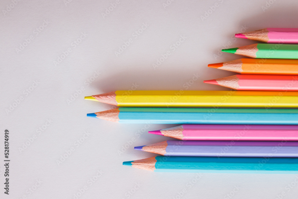 Set of colored pencils, school equipment on the table Set of colored pencils, school equipment on the table