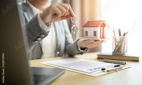 Business people signing contract making deal with real estate agent Concept for consultant home insurance.Real estate investment Property insurance security. Real estate agent offer house