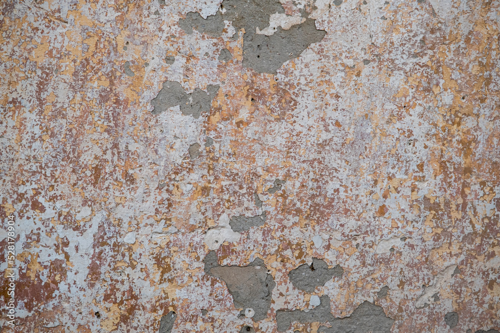 Fototapeta premium The texture of the old plaster on the wall of the house. Stylish vintage background