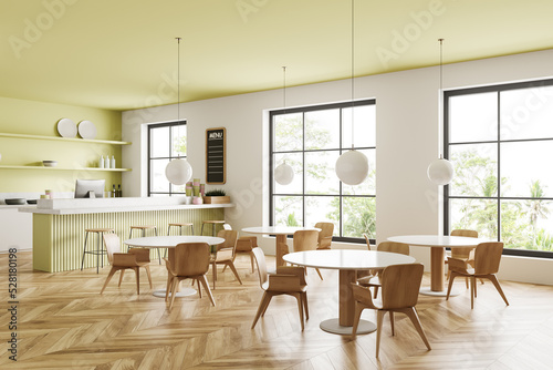 Corner view on modern bright cafe interior with panoramic window © ImageFlow