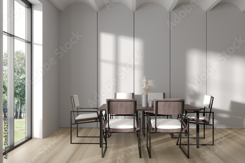 Side view on bright dining room interior with dining table
