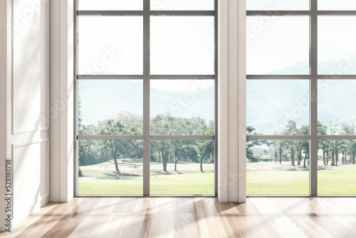 Bright empty living room interior with panoramic window © ImageFlow