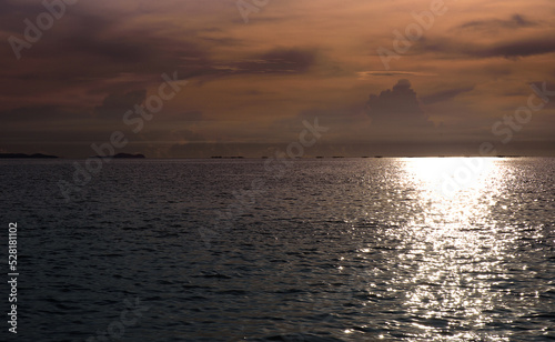 The landscape of sunrise or sunset has beautiful golden reflections over the sea.