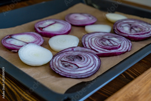 sliced onions on a wooden cutting board