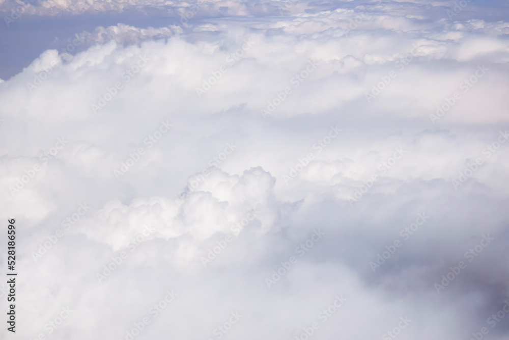 Cloudy sky. Beautiful sky with lots of white fluffy cumulus clouds, natural abstract background, full frame. Soft focus. Cloudy sky. Beautiful sky with lots of white fluffy cumulus clouds, natural abstract background, full frame. Soft focus.
