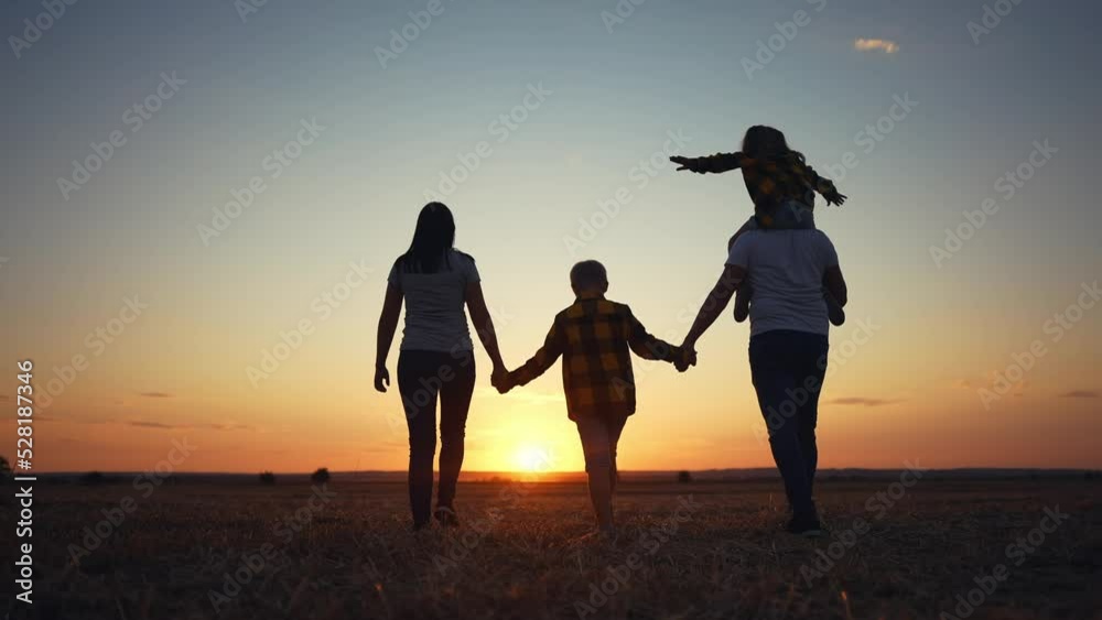 people in the park. friendly family a walking holding hands. happy family kid dream concept. big family walk on vacation running together in nature in the park lifestyle. happy family silhouette