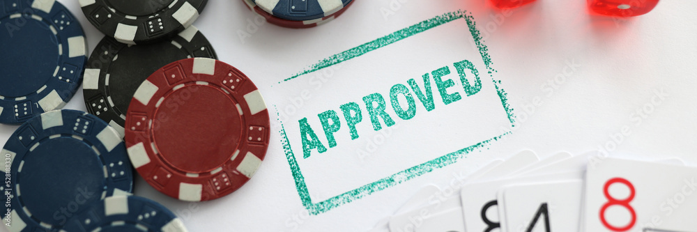 Stamp approved standing near playing cards and chips in casino with dice closeup Stamp approved standing near playing cards and chips in casino with dice closeup