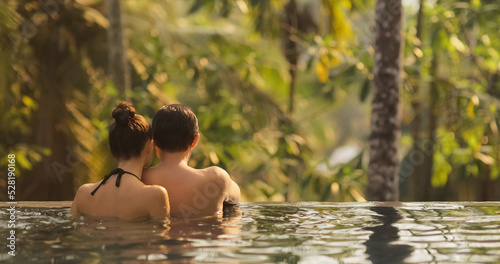 Couple in Love Together in Infinity Swimming Pool Outdoors During © Buyanskyy Production