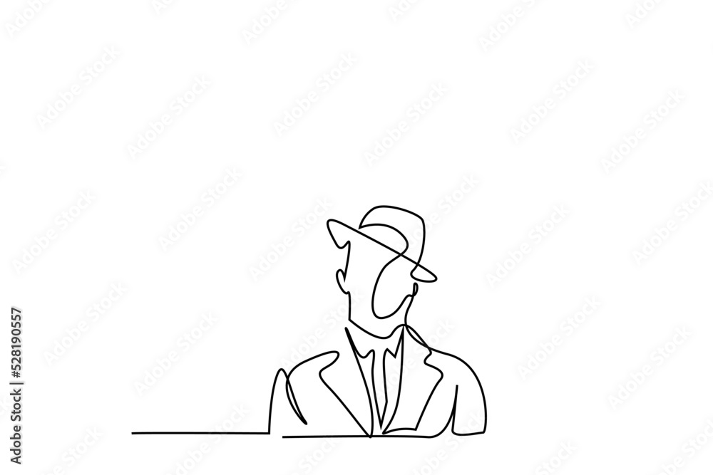 a man in a suit with an old stylish hat stands seriously portrait concept