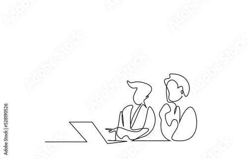 business people are analyzing and talking looking at desk laptop in office