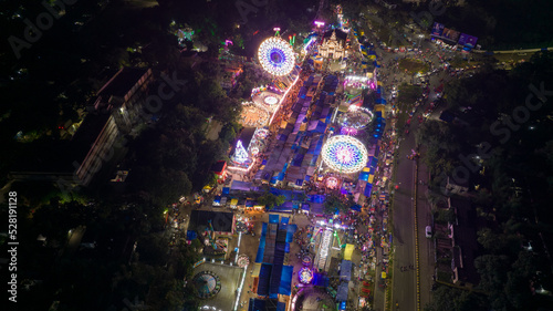 Aerial view of Giant Wheels at Indian fair, Ferris wheel in mela, drone view photo