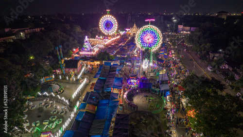 Aerial view of Giant Wheels at Indian fair, Ferris wheel in mela, drone view photo