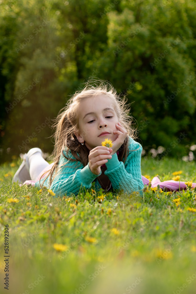 A little girl with spring flowers. A little girl with spring flowers.