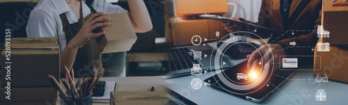 Startup small business entrepreneur or freelance Asian woman using a laptop with box, Young success Asian woman with her hand lift up, online marketing packaging box and delivery, SME concept.