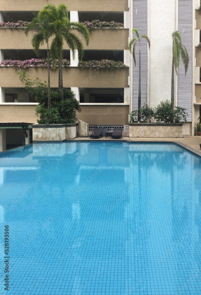 well-being pool area near condominium, tropic climate architecture, vertical