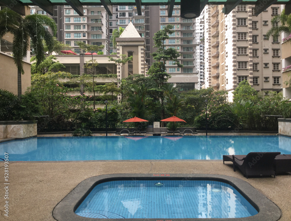 well-being pool area near condominium, tropic climate architecture, horizontal