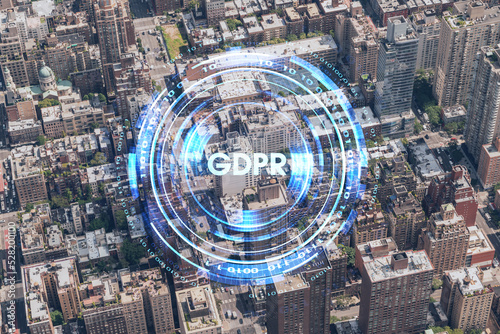Aerial top view of New York City building roofs. Bird s eye view from helicopter of metropolis cityscape. GDPR hologram  concept of data protection regulation and privacy for all individuals