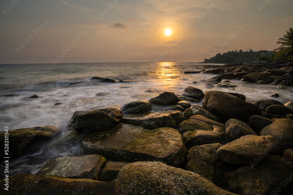 Rock beach during sunset at Koh Kood (Ko Kut), Ko Kut District, Trat Province, Thailand Rock beach during sunset at Koh Kood (Ko Kut), Ko Kut District, Trat Province, Thailand