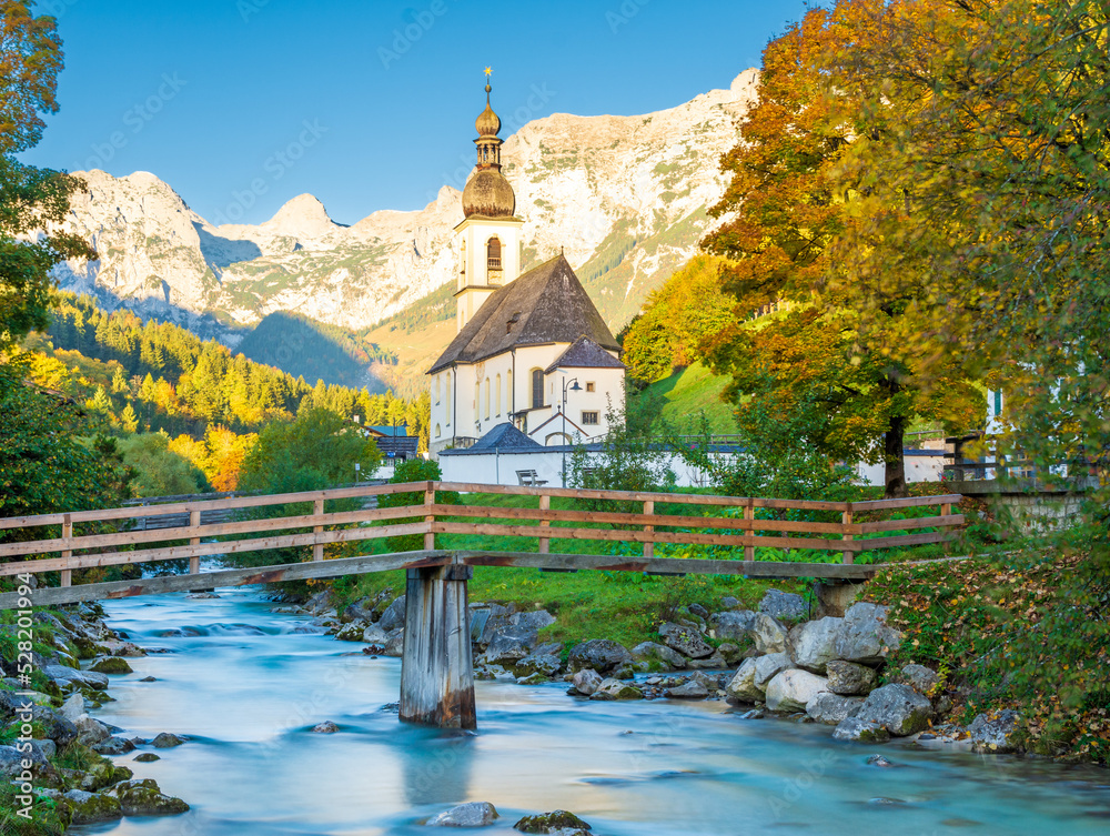 charming alpine church with river and Alps in Berchtesgaden in Bavaria in Germany during autumn