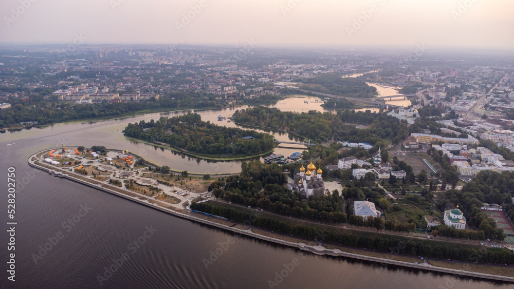 Drone aerial view of the historical center of Yaroslavl, Russia, with the Cathedral of the Assumption and the boulevard at sunset. travel background