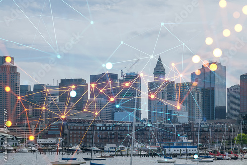 Panorama city view of Boston Harbor at day time, Massachusetts. Buildings of financial downtown. Glowing Social media icons. The concept of networking and establishing new connections between people