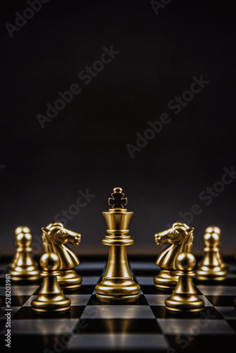 King chess stand teamwork on chessboard concepts of competition challenge of leader business team or volunteer or wining and leadership strategic plan and risk management or team player.