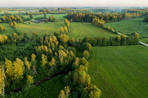 An aerial view to mosaic rural landscape with fields and forests in Estonia, Northern Europe. 