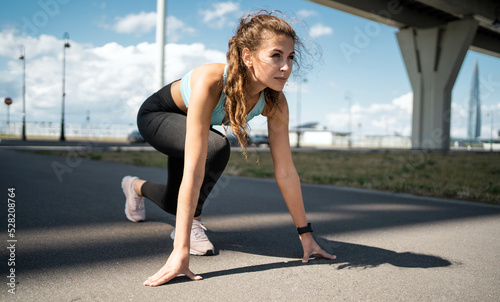 Photos Runner slender young woman aerobics workout in comfortable clothes and sneakers