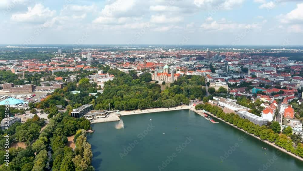New Town Hall (Neues Rathaus) and Hannover city center aerial view, Germany, Europe. Aircraft point of view aerial shot ft. Maschsee Lake and parks around Hanover-Mitte, the historic heart of the city