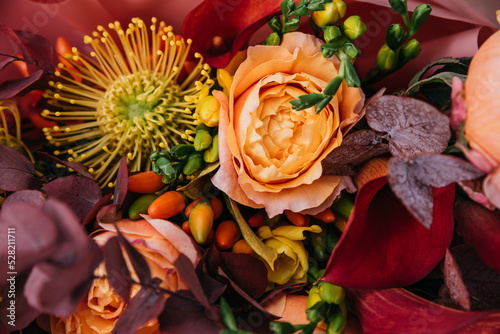 Fototapeta Naklejka Na Ścianę i Meble -  Red pink orange Autumn Colorful fall bouquet. Beautiful flower composition with autumn orange and red flowers. Flower shop and florist design concept. close up, floral background
